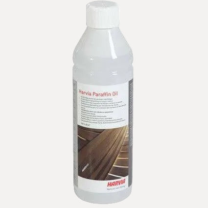 Harvia Paraffin Oil 500ml, front view of white bottle with screw cap on a plain gray background