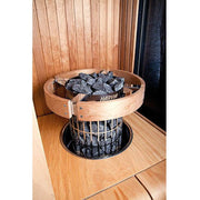 Harvia Cilindro HPC3 Safety Railing for 6 & 8kW Sauna Heaters, wood guard installed around a stone filled heater in a cedar sauna corner