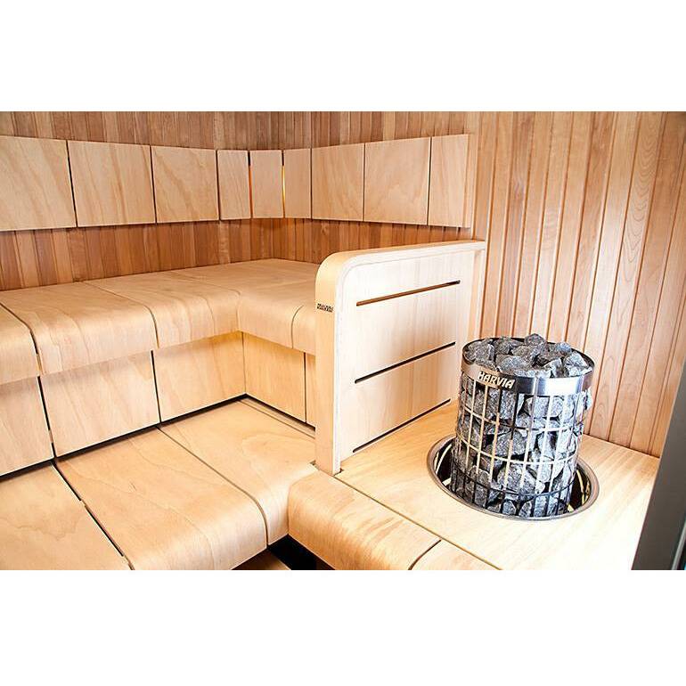 Harvia Cilindro Embedding Flange for 6 & 8kW Sauna Heaters, wide view of a corner sauna with the heater and flange installed beside a wooden bench.
