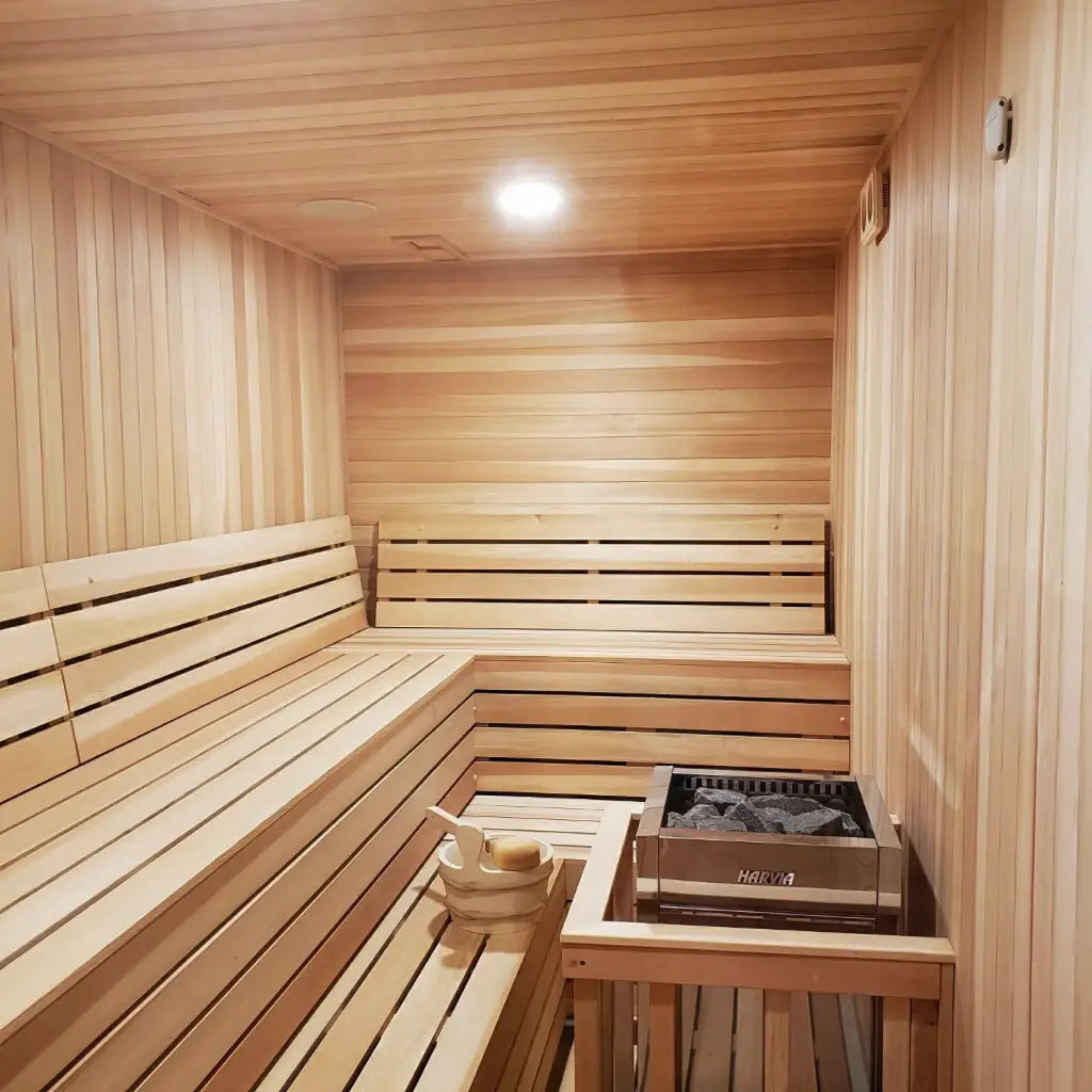 Corner view of a Custom Indoor Sauna Room with all-glass door