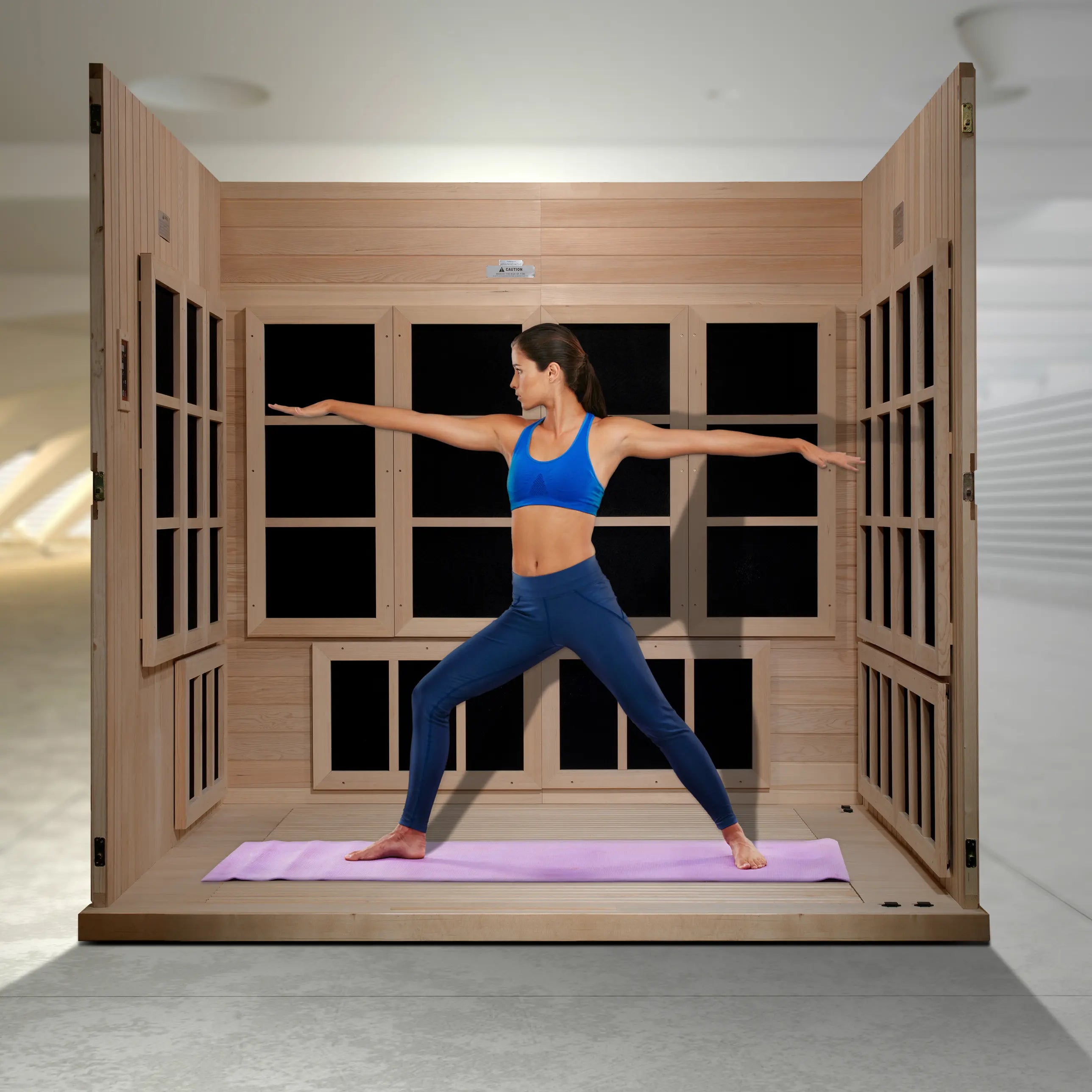 Interior of the Golden Designs Catalonia 8 person sauna with benches removed for hot yoga