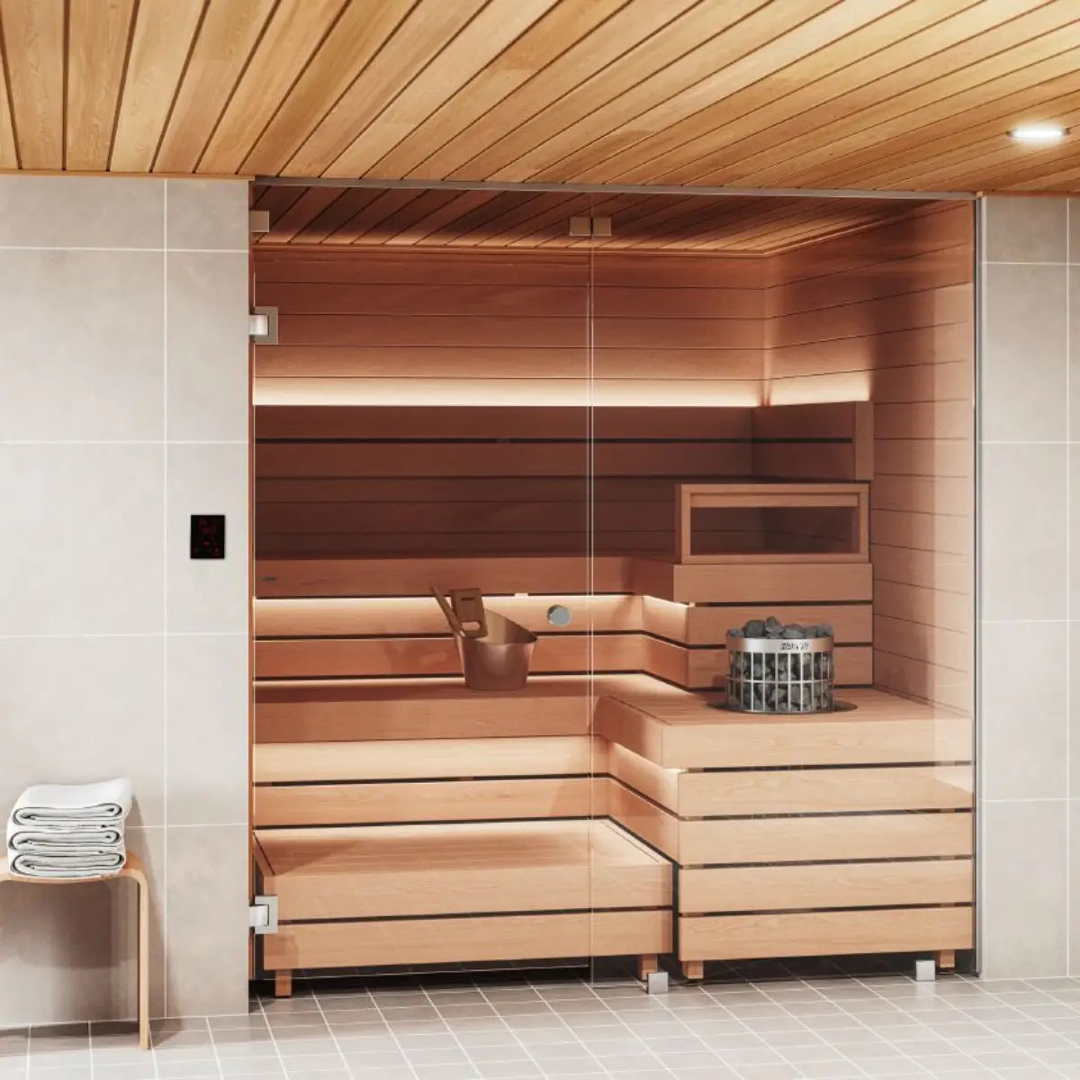 Harvia Cilindro PC60 6kW Electric Sauna Heater with Built-In Controls, in a glass front home sauna with a bucket, ladle, and wall control panel.