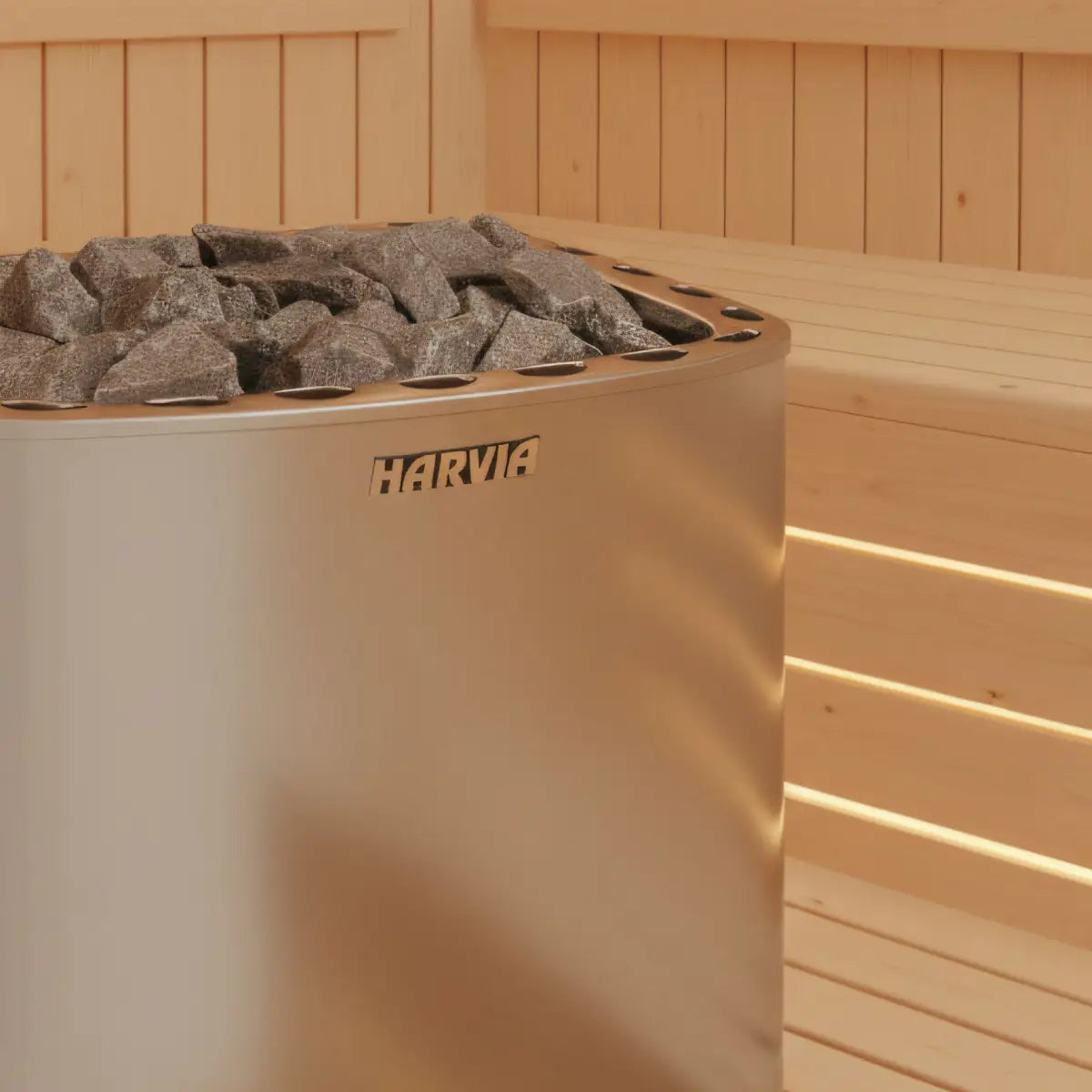 Harvia Club KG10G-U3 10kW Electric Sauna Heater, close up of the stone bed and logo plate in the corner of a wood paneled sauna.