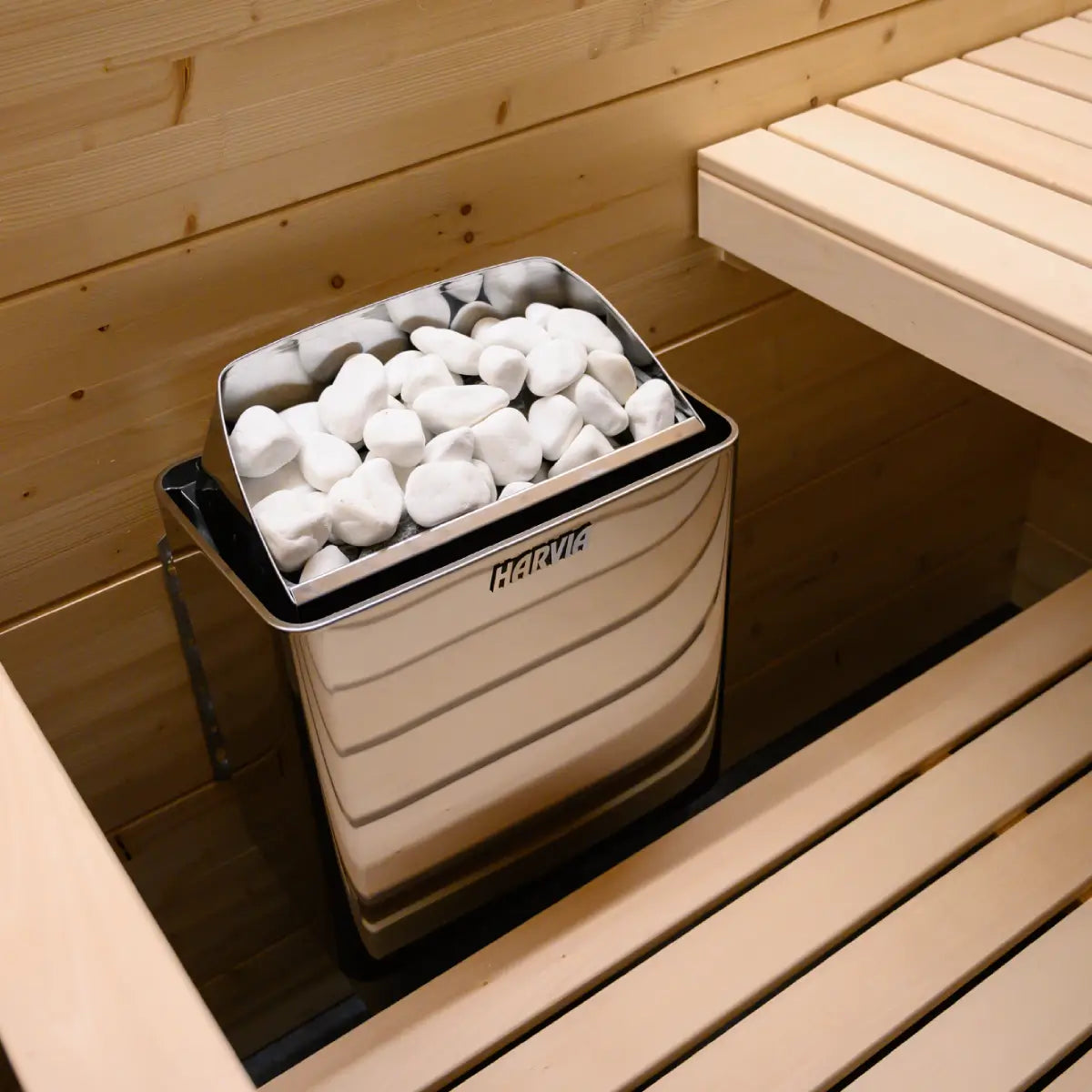 Harvia KIP60W 6kW Electric Sauna Heater, overhead close up of white sauna stones loaded in the top rock basket
