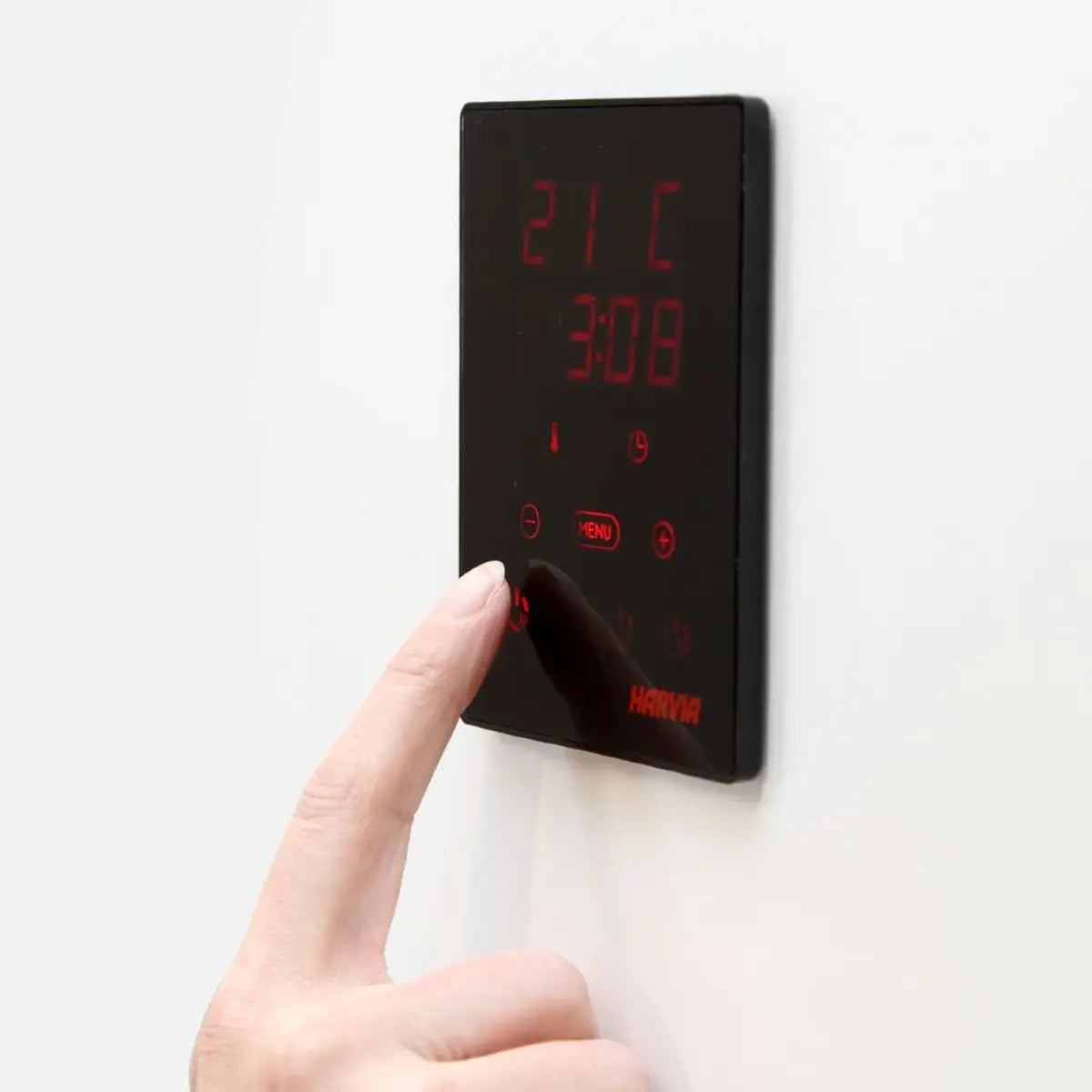 Harvia Xenio CX30C-U3-XW Wi-Fi Sauna Control Unit, a hand pressing the touchscreen panel on a white background
