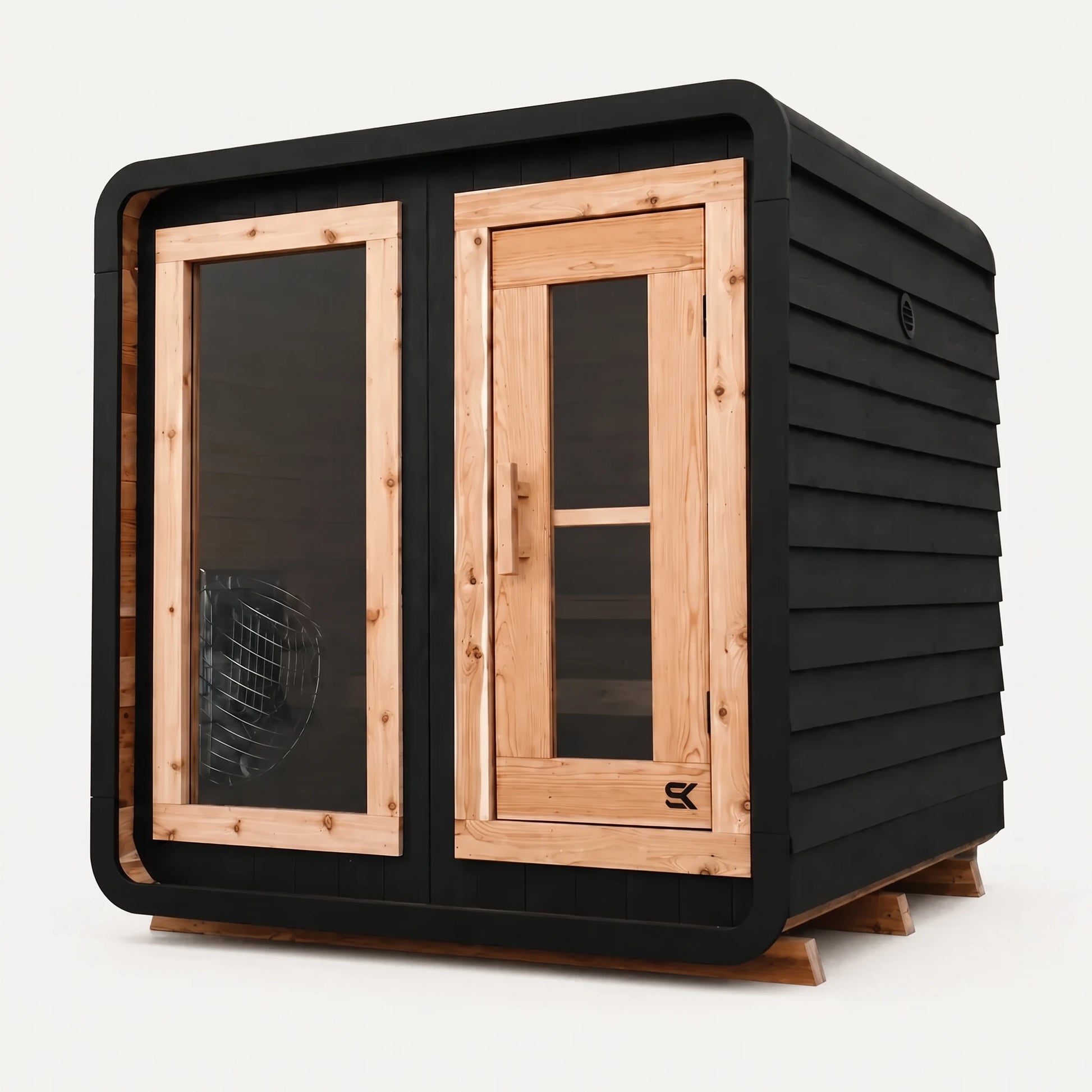 The Sweat Cabin Blackout Edition charred cedar 4-person sauna three-quarter angle on white background showing rounded corners, glass side panel with heater visible, and natural cedar door frame.