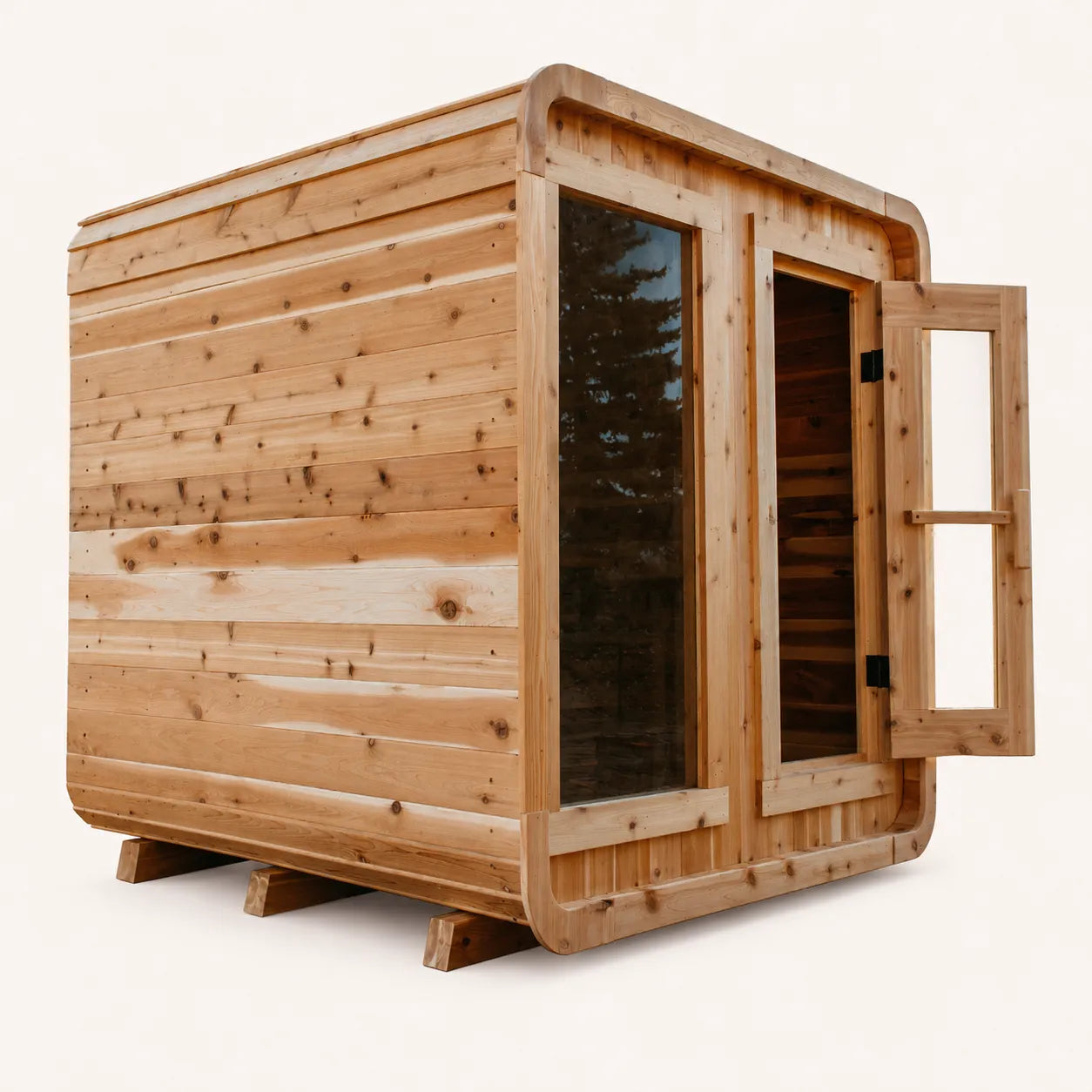 The Sweat Cabin cedar sauna with door open showing interior bench and large picture window, side angle on white background.