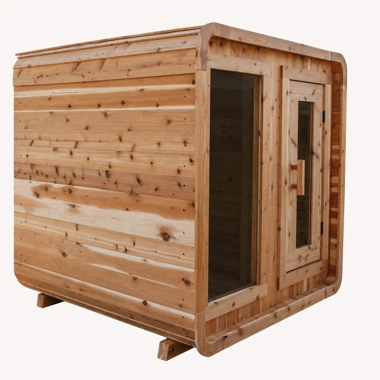 The Sweat Cabin cedar 4-person sauna side-angled view showing horizontal cedar siding and rear panel on white background.