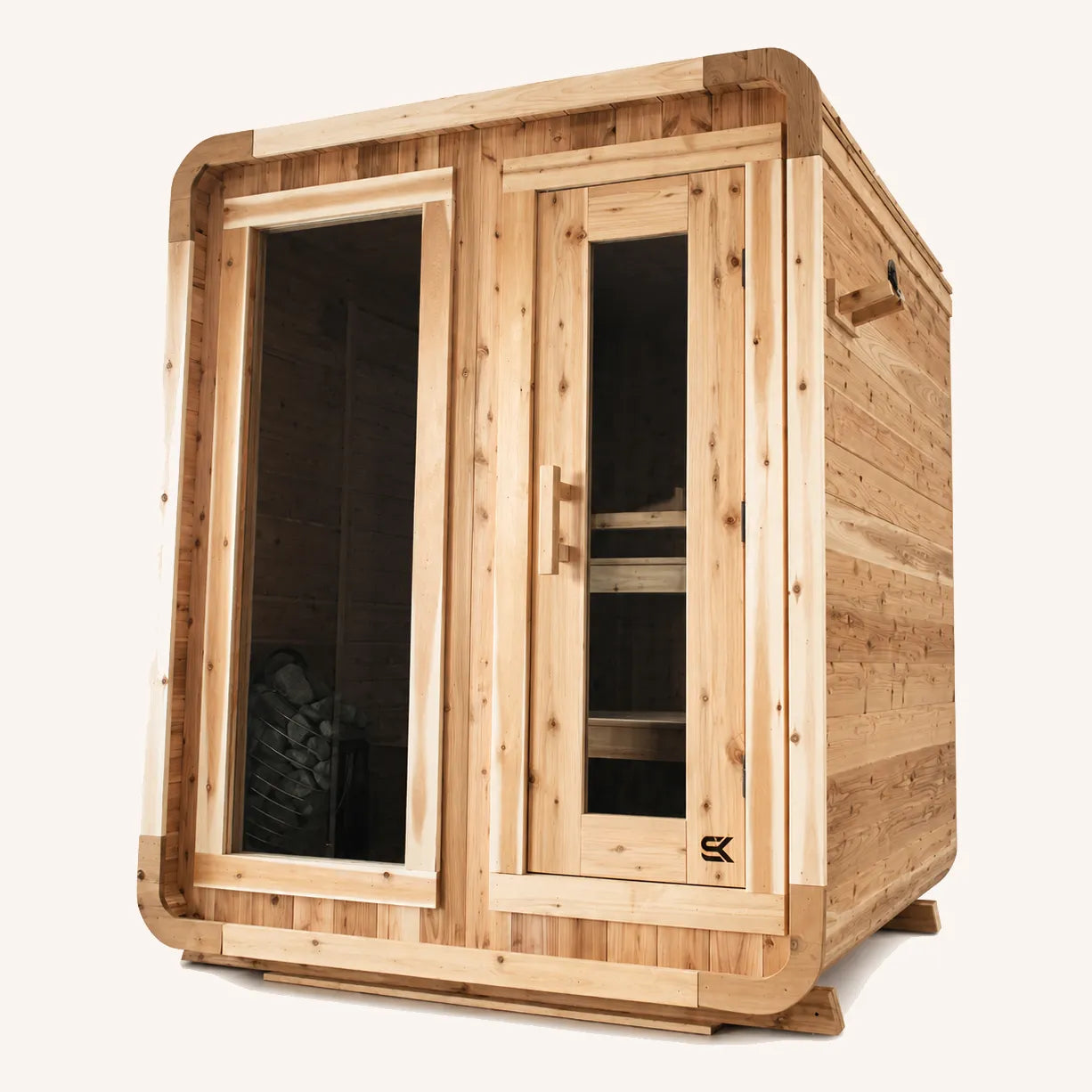The Sweat Cabin cedar 4-person sauna front-angled view showing picture window with heater visible inside, glass door, and cedar bench.