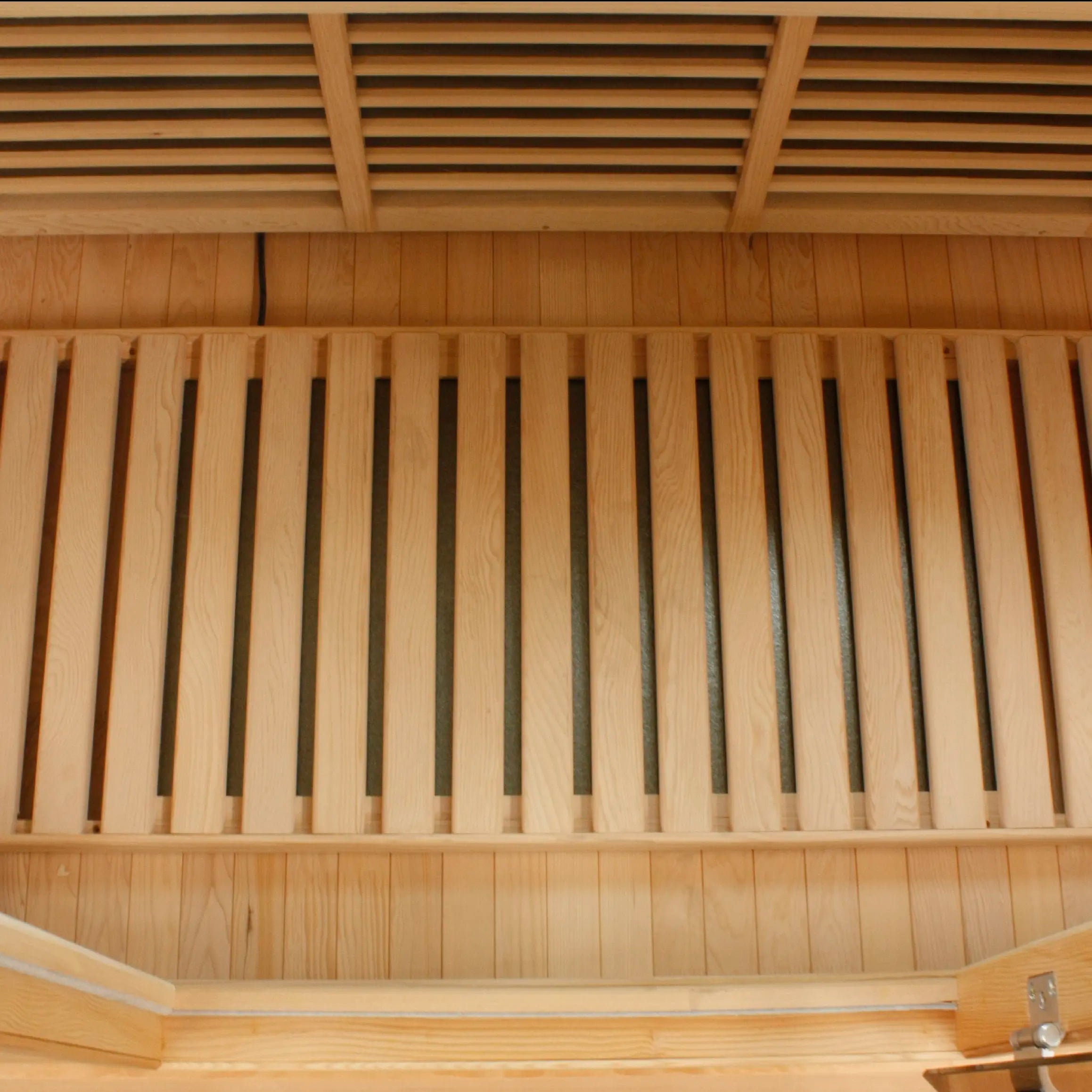 Floor-mounted carbon far infrared heating panel in the Golden Designs Maxxus 3 Person Corner sauna