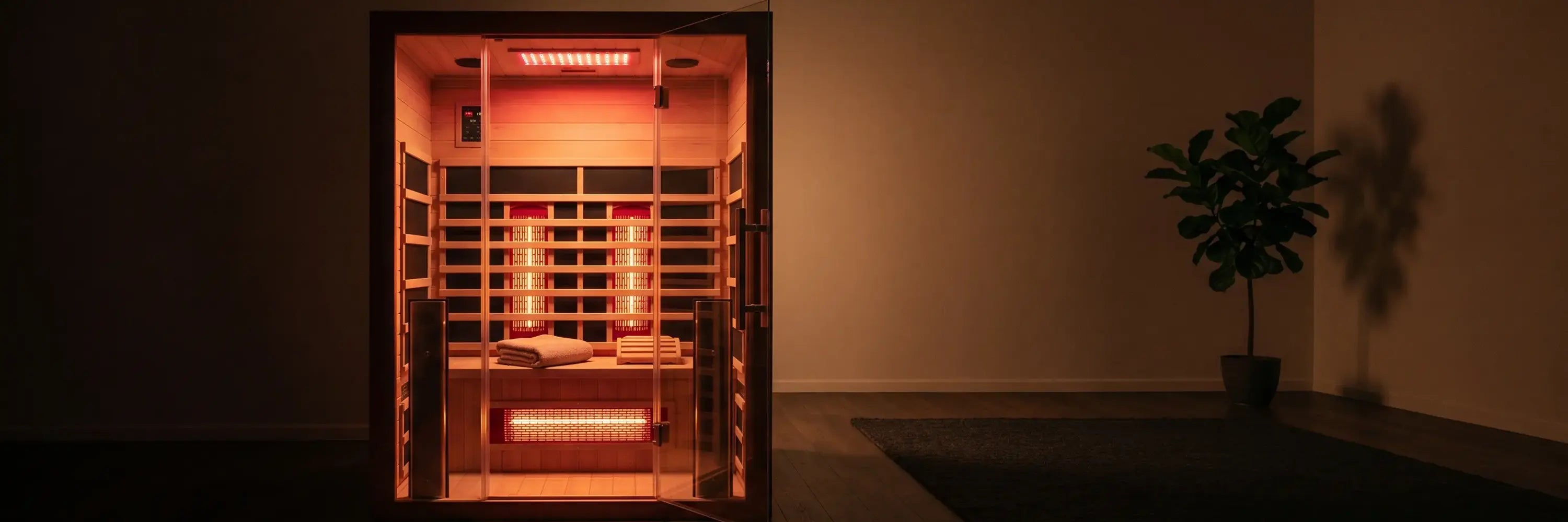 Full spectrum infrared saunas, a cedar cabin glowing with red light therapy and near, mid and far infrared heaters