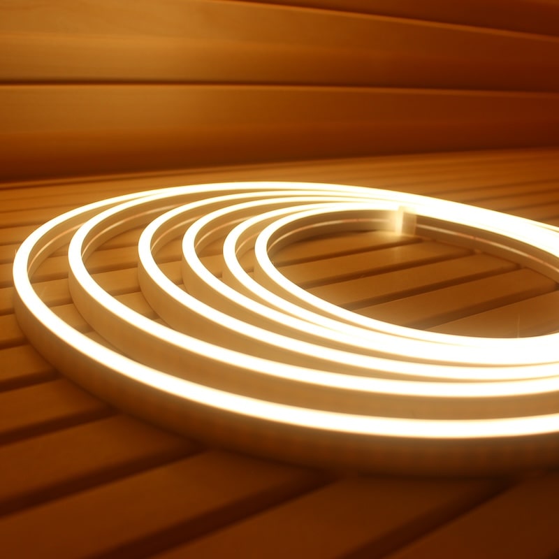 Lit PROSAUNAS warm white flexible LED strip showing smooth dotless sauna lighting