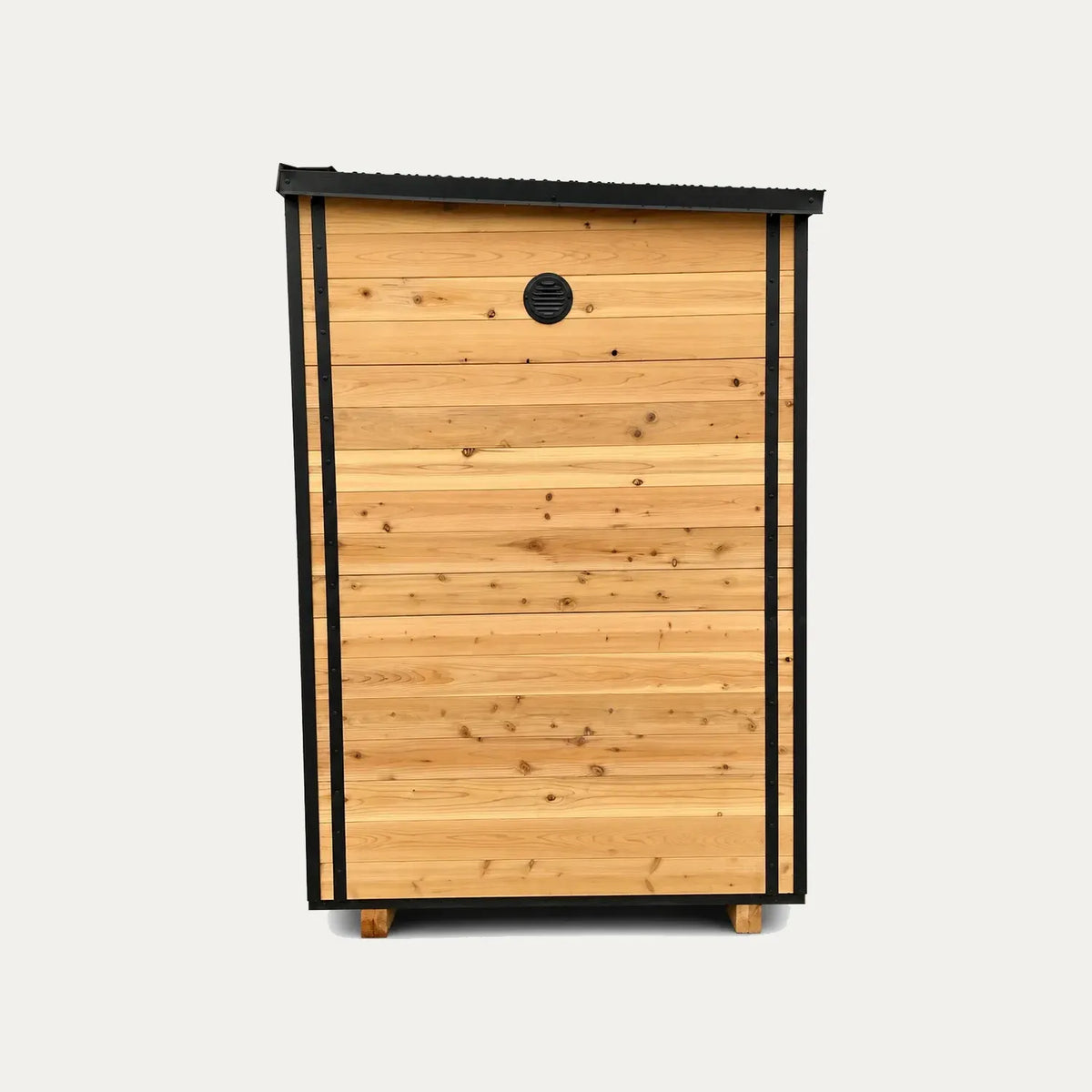 Side view of the Sweat Kingdom Ascent 6-person sauna showing wood siding, black trim, and an upper wall vent.