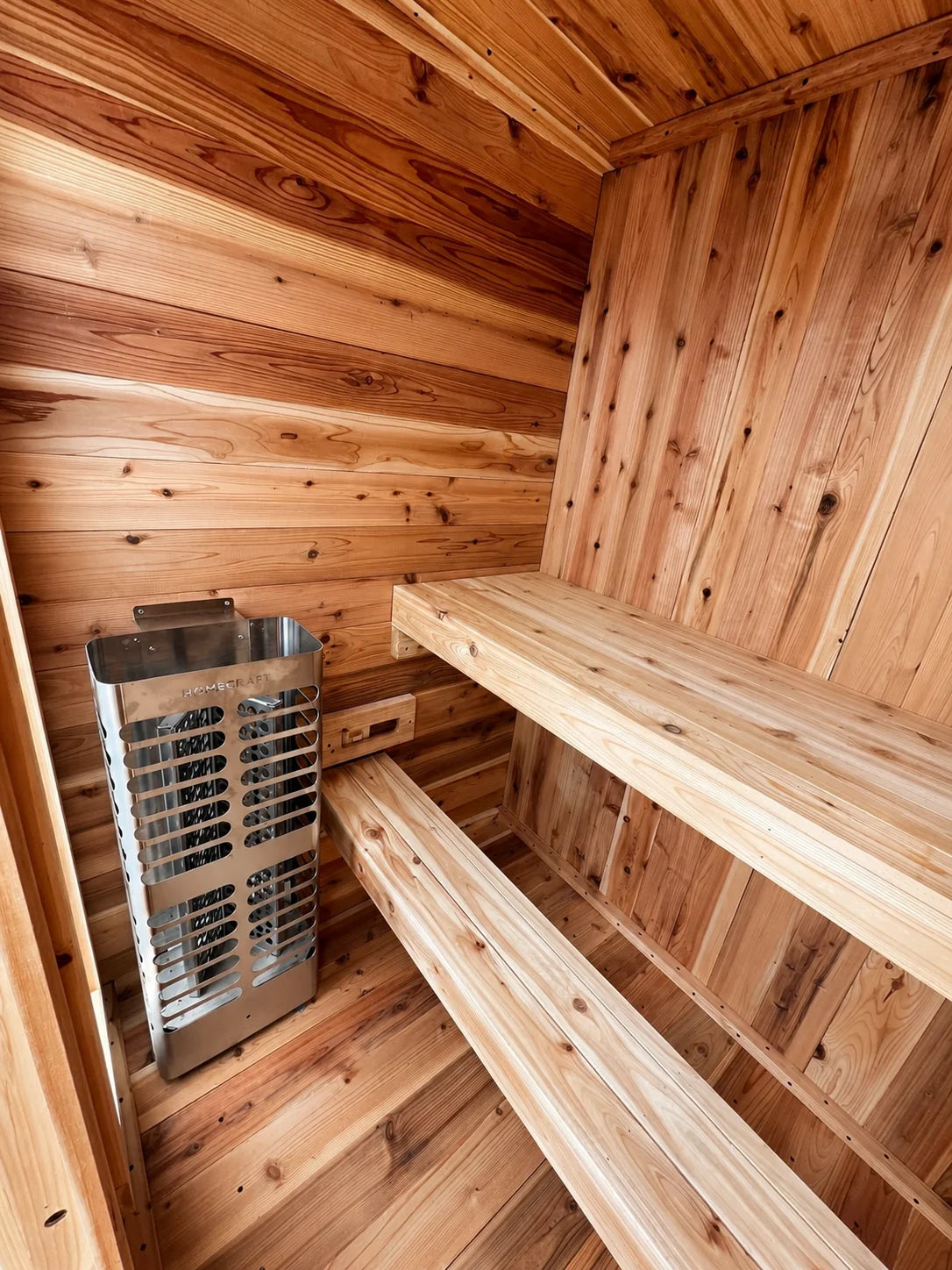 Homecraft heater beside the cedar bench and lower footrest inside the Sweat Kingdom Ridge 2-person sauna.