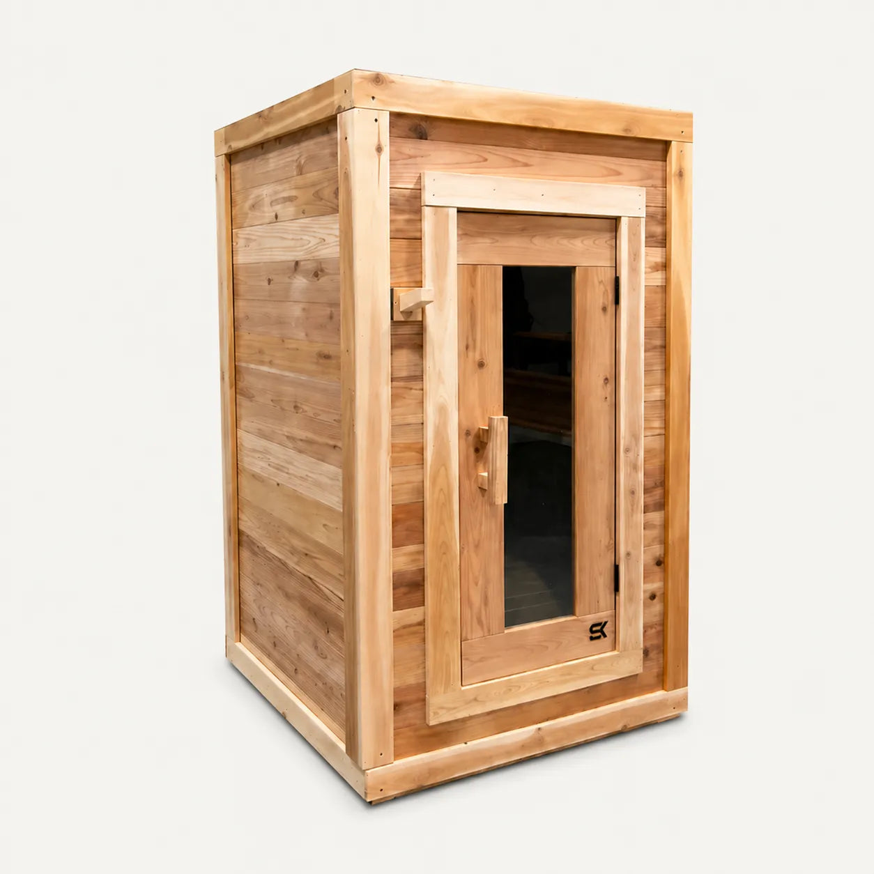 The Sweat Box one-person red cedar sauna on white background showing front door and left side.